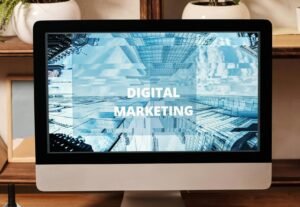 Contemporary office setup featuring digital marketing strategy on a computer screen, ideal for business technology themes.